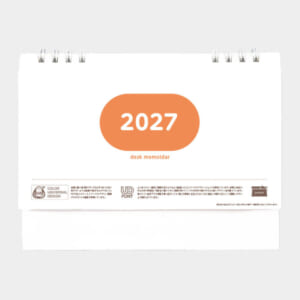Desk calendar page showing the year 2027 in an orange rounded oval on a white background.